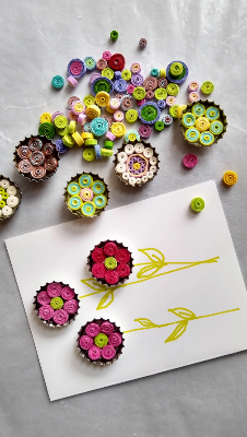 flowers made from bottle caps and tightly would paper