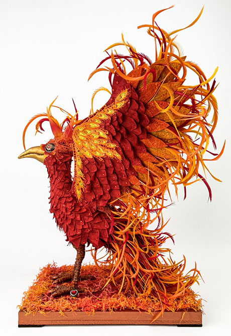 A vibrant, intricately designed phoenix sculpture in shades of red and orange, featuring detailed feathers and a golden beak. A vibrant, intricately designed phoenix sculpture in shades of red and orange, featuring detailed feathers and a golden beak.