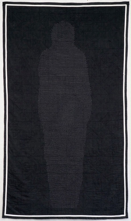 A black quilt featuring a silhouette outlined in tiny white stitches, set within a bordered frame, emphasizing depth and form. A black quilt featuring a silhouette outlined in tiny white stitches, set within a bordered frame, emphasizing depth and form.