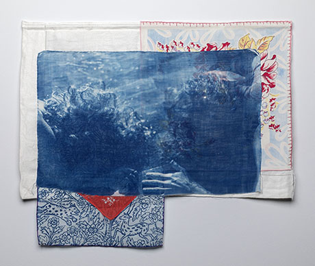 Three layered textiles are displayed. The top one features a blue underwater image of a person. The other two have floral patterns, creating a nostalgic vibe.