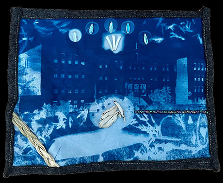 Blue textile art features abstract geometric patterns and light shapes, resembling a cityscape. Accents include a braid and handcrafted elements, creating a mystical tone.