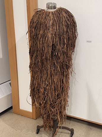 Traditional skirt and chest piece made with natural willow fibers. 