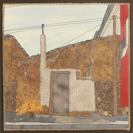 Textile artwork of a weathered building facade with a closed door, leaning pole, wires, and a pot of orange flowers on the sidewalk, by Kathleen McCabe