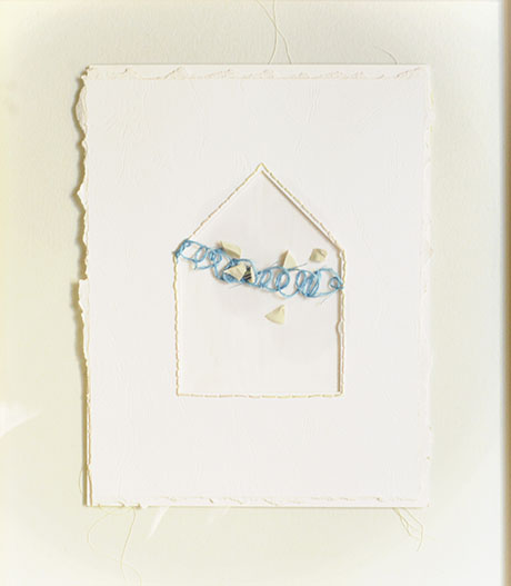 White textured paper with an embossed house outline. Inside, a blue thread is delicately arranged, with scattered white fragments, creating a peaceful tone. White textured paper with an embossed house outline. Inside, a blue thread is delicately arranged, with scattered white fragments, creating a peaceful tone.